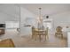 Elegant dining area with a chandelier, neutral colors, and easy access to the living spaces at 615 Blue Park Rd, Orange City, FL 32763