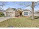 Inviting one-story home with a well-kept lawn, beautiful landscaping, and a welcoming entrance at 615 Blue Park Rd, Orange City, FL 32763