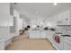 Spacious kitchen with ample counter space, modern appliances, and convenient access to the living room at 615 Blue Park Rd, Orange City, FL 32763