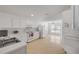 Well-lit kitchen area with ample counter space, white appliances, and a functional layout for cooking at 615 Blue Park Rd, Orange City, FL 32763
