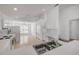 Bright and airy kitchen with white appliances, open layout, and easy access to dining and living areas at 615 Blue Park Rd, Orange City, FL 32763