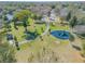 Community playground featuring swings, a slide, and green space, perfect for outdoor activities and Gathering fun at 615 Blue Park Rd, Orange City, FL 32763