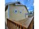 Exterior view of a yellow house with a wooden deck and octagonal windows at 615 S Laurel Ave, Sanford, FL 32771