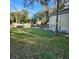 Spacious backyard view of the home, shed, and grassy area, ideal for outdoor enjoyment and activities at 615 S Laurel Ave, Sanford, FL 32771