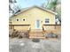 Charming home with a spacious deck, showcasing lovely exterior details and landscaping at 615 S Laurel Ave, Sanford, FL 32771