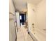 Bathroom with a shower and bathtub, and a view into the adjacent bedroom at 615 S Laurel Ave, Sanford, FL 32771