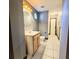 Bathroom featuring a single sink vanity, toilet, and tiled floor at 615 S Laurel Ave, Sanford, FL 32771