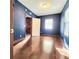Bedroom with hardwood floors, window with blinds, and neutral wall color at 615 S Laurel Ave, Sanford, FL 32771