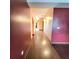 Hallway with hardwood floors and textured walls, leading to other rooms at 615 S Laurel Ave, Sanford, FL 32771