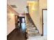 Hallway and staircase with wood and carpet, leading to the upper level at 615 S Laurel Ave, Sanford, FL 32771