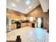 Spacious kitchen with stainless steel appliances, light wood cabinets, and a skylight at 615 S Laurel Ave, Sanford, FL 32771