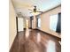 Large living room with hardwood floors, multiple windows, and neutral paint at 615 S Laurel Ave, Sanford, FL 32771