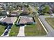 Aerial view of a single-Gathering home with a well-manicured lawn at 702 Pelican Ct, Kissimmee, FL 34759