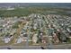 Aerial view of the neighborhood, providing an overview of nearby amenities and community layout at 702 Pelican Ct, Kissimmee, FL 34759