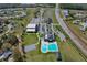 Aerial view of community buildings, pool, basketball court and main thoroughfare at 702 Pelican Ct, Kissimmee, FL 34759