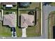 Aerial view of a single-story home featuring a well-maintained lawn and a fenced-in backyard at 702 Pelican Ct, Kissimmee, FL 34759