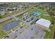 Aerial view of community buildings, pool and parking at 702 Pelican Ct, Kissimmee, FL 34759