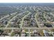 Panoramic view indicating general area, demonstrating a quiet neighborhood with tree-lined streets at 702 Pelican Ct, Kissimmee, FL 34759