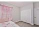 Bedroom features a single bed and large closet at 702 Pelican Ct, Kissimmee, FL 34759