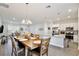 Bright dining room with hardwood floors and an open concept to the kitchen and living room at 702 Pelican Ct, Kissimmee, FL 34759