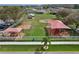 Community playground with slides and swing sets covered by shade structures at 702 Pelican Ct, Kissimmee, FL 34759