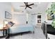 Bright bedroom featuring a ceiling fan, closet, ensuite bathroom, and access to kitchen at 726/720 N Pennsylvania Ave, Winter Park, FL 32789