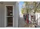 Side of house with gravel, bikes, storage and backdoor access to the interior at 726/720 N Pennsylvania Ave, Winter Park, FL 32789