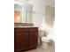 Bathroom with a wood vanity, granite countertop, and a tub-shower combination at 7681 Fordson Ln, Windermere, FL 34786