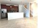Kitchen boasts stainless steel appliances, wood cabinets, and breakfast bar at 7681 Fordson Ln, Windermere, FL 34786