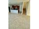 Open-concept living area with tile flooring that flows into adjacent kitchen area at 7681 Fordson Ln, Windermere, FL 34786