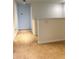 Carpeted hallway space with railing and trim at 7681 Fordson Ln, Windermere, FL 34786