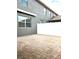 Private outdoor patio area with paved brick flooring and a white fence at 7681 Fordson Ln, Windermere, FL 34786