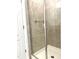 Shower stall featuring a glass door and tile walls at 7681 Fordson Ln, Windermere, FL 34786