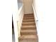 Carpeted staircase with white railing at 7681 Fordson Ln, Windermere, FL 34786