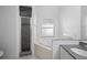 Bright bathroom featuring tub, shower, and granite counters at 8519 Rainbow Ave, Orlando, FL 32825