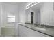 Large bathroom with dual vanity, granite counters, tub and shower at 8519 Rainbow Ave, Orlando, FL 32825