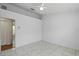 Simple bedroom featuring tile floors, walk-in closet and ensuite bathroom at 8519 Rainbow Ave, Orlando, FL 32825