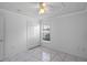 Cozy bedroom featuring ceiling fan, closet and marble-style tile floors at 8519 Rainbow Ave, Orlando, FL 32825