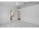 Spacious bedroom featuring tile floors and attached bathroom with granite counters at 8519 Rainbow Ave, Orlando, FL 32825