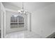 Dining room featuring a chandelier and tile floors at 8519 Rainbow Ave, Orlando, FL 32825