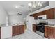 Updated kitchen boasts stainless appliances, granite counters, and marble tile floors at 8519 Rainbow Ave, Orlando, FL 32825