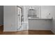 Kitchen featuring a breakfast bar, white appliances and tile floors at 8519 Rainbow Ave, Orlando, FL 32825