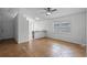 Bright living room featuring tile flooring, a ceiling fan and a pass-through to the kitchen at 8519 Rainbow Ave, Orlando, FL 32825