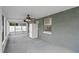 Covered patio featuring dual ceiling fans, and a refrigerator at 8519 Rainbow Ave, Orlando, FL 32825