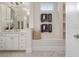 Luxurious bathroom featuring marble floors, built in vanity, and neutral walls at 9454 Becker Ct, Orlando, FL 32827