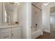 Bathroom with white vanity, quartz counters, and shower-over-tub with white subway tile at 9454 Becker Ct, Orlando, FL 32827