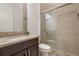 Neutral bathroom with glass-enclosed shower, granite countertop, and classic finishes at 9454 Becker Ct, Orlando, FL 32827