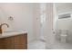 Bright bathroom features a modern vanity and marble-tiled shower with glass enclosure at 9454 Becker Ct, Orlando, FL 32827