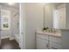Bathroom with white vanity, quartz counters, and shower-over-tub with white subway tile at 9454 Becker Ct, Orlando, FL 32827