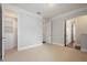 Well-lit bedroom showcasing plush carpeting, ample closet space, and access to the en-suite bathroom at 9454 Becker Ct, Orlando, FL 32827